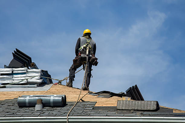 Professional Roof Replacement technician working in Newfield, NY